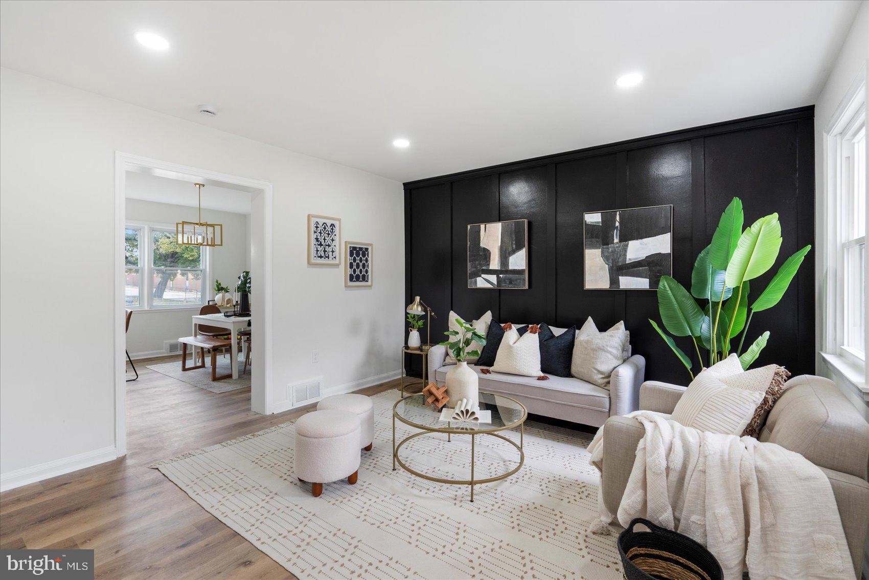 1656 Ramblewood Road Baltimore, MD 21239 - Photo 6 of 40 a living room with furniture and a potted plant