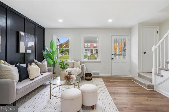 a living room with furniture and a rug