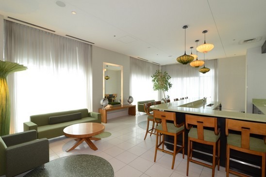 125 South Green Street, Unit 809A Chicago, IL 60607 - Photo 2 of 10 a dining room with wooden floor a chandelier a wooden table and chairs
