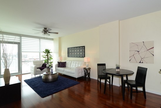 125 South Green Street, Unit 809A Chicago, IL 60607 - Photo 5 of 10 a view of a dining room with furniture and wooden floor