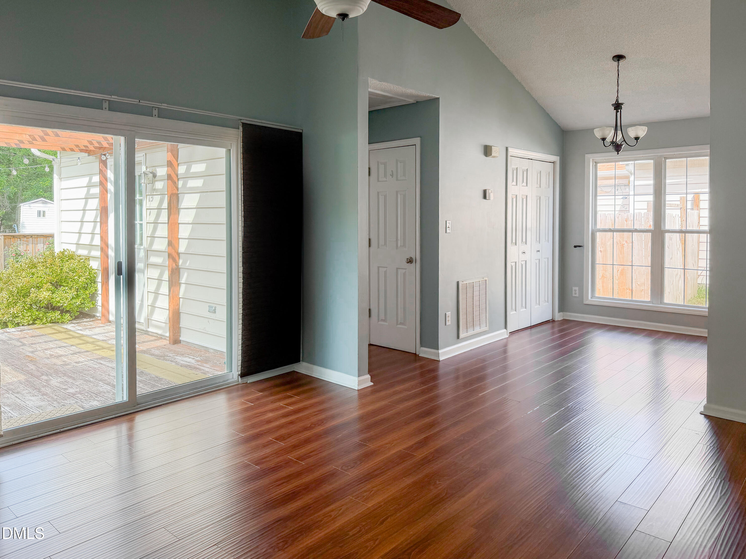 6304 Forest Ridge Drive Durham, NC 27713 - Photo 4 of 29 a view of a big room with wooden floor and windows