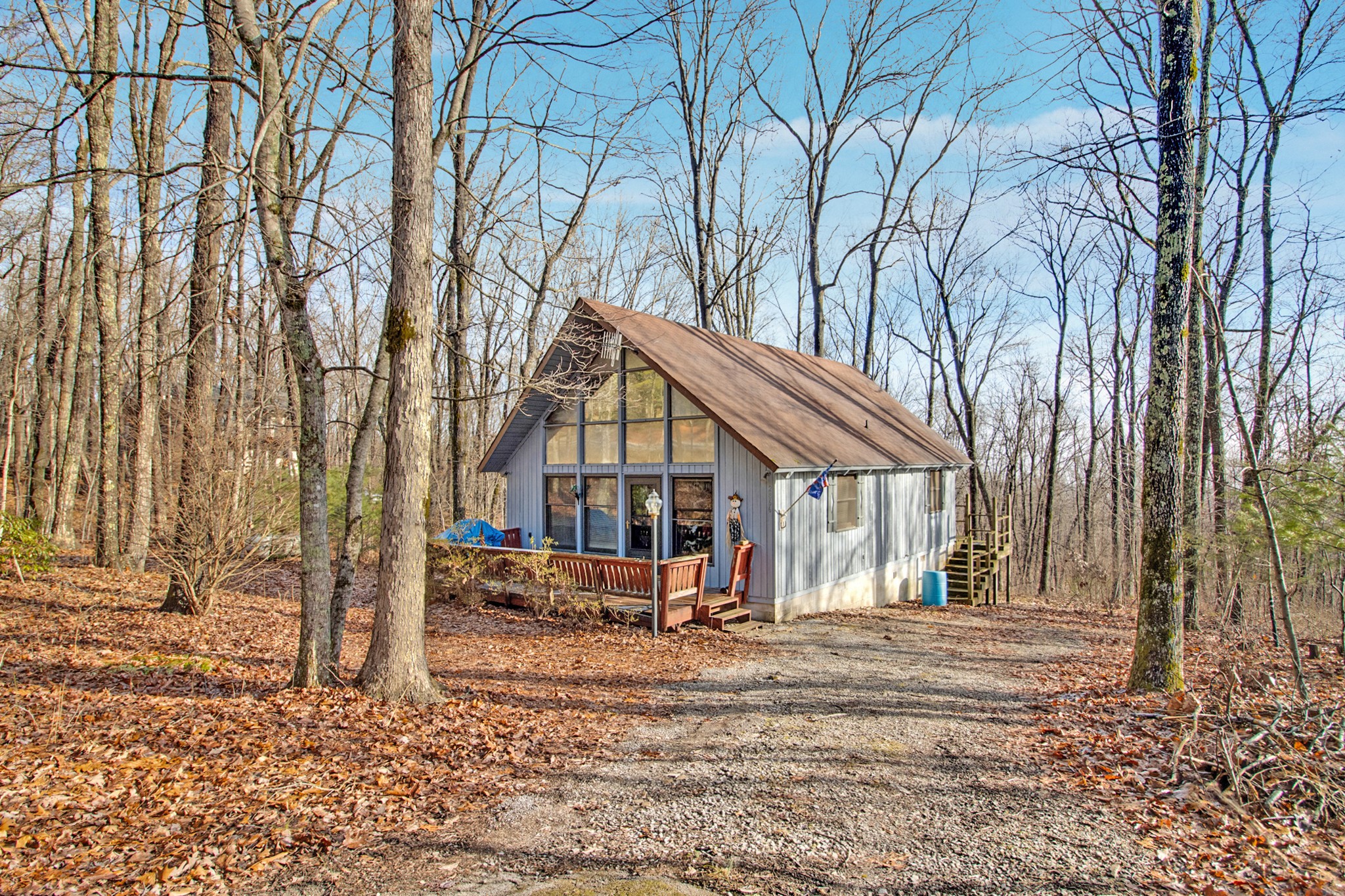 2866 Renegade Mountain Parkway Crab Orchard, TN 37723 - Photo 1 of 28 a view of a white house with a yard covered in snow