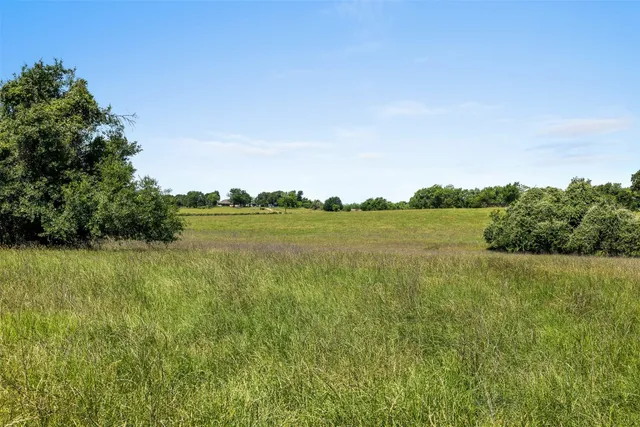 a view of a lake with houses in the back