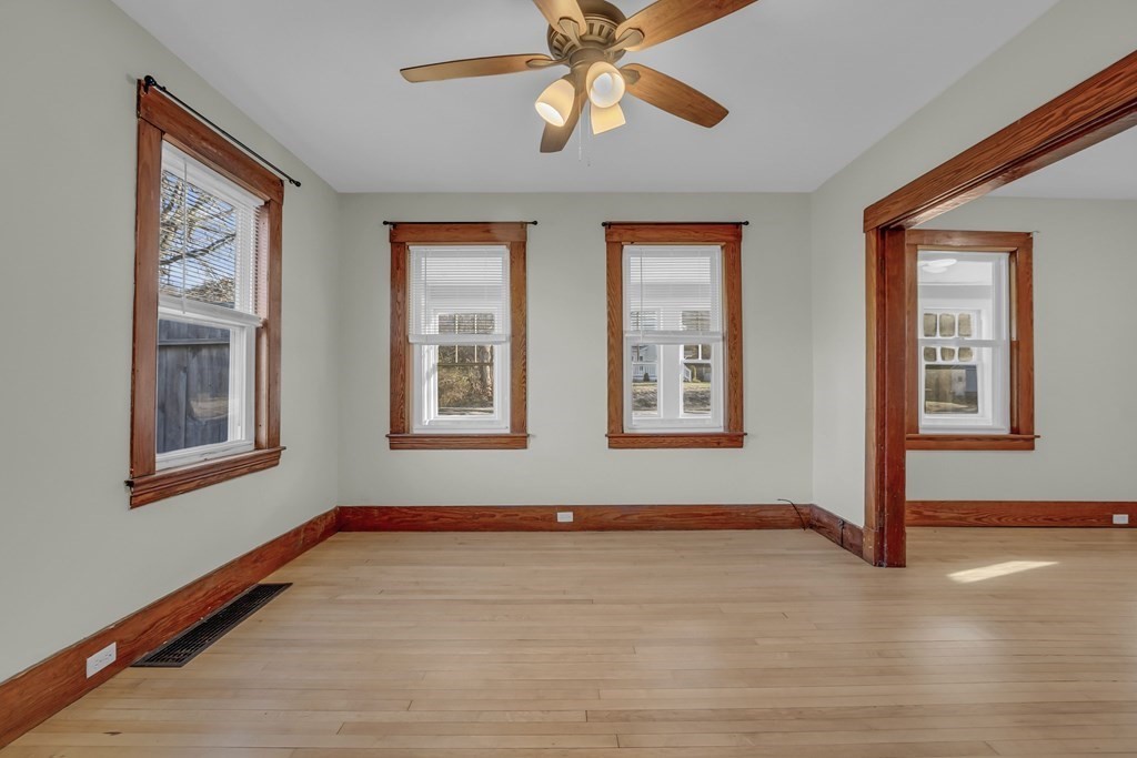 233 Petersham Road Athol, MA 01331 - Photo 14 of 31 a view of an empty room with window and wooden floor
