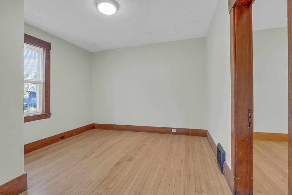 233 Petersham Road Athol, MA 01331 - Photo 16 of 31 a view of an empty room with wooden floor and a window