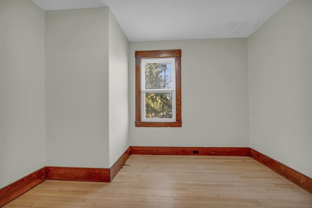 233 Petersham Road Athol, MA 01331 - Photo 19 of 31 a view of an empty room with window and wooden floor