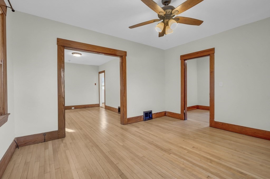 233 Petersham Road Athol, MA 01331 - Photo 10 of 31 a view of an empty room with window and wooden floor