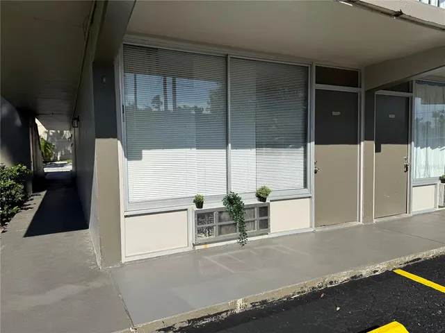 a kitchen with a refrigerator and cabinets