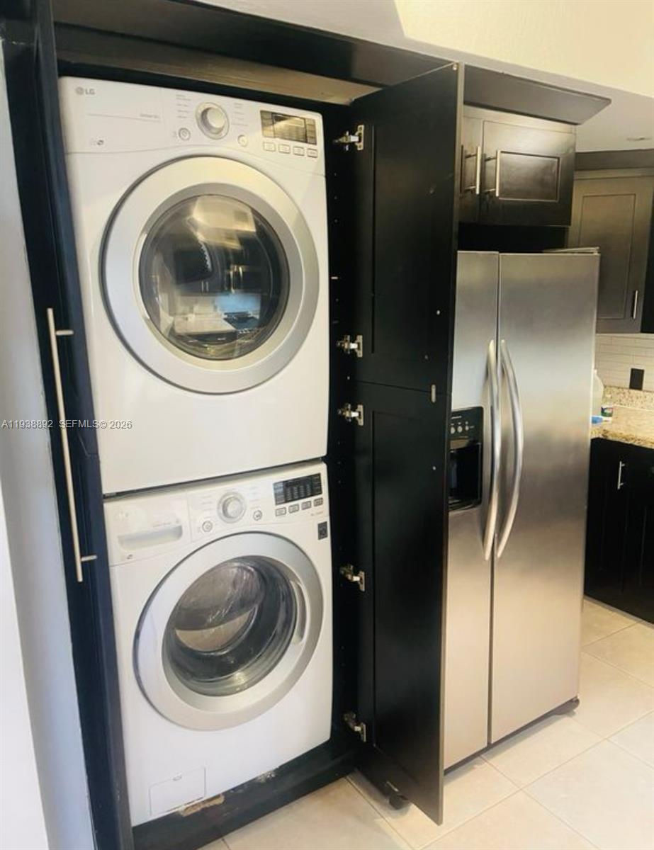 17455 Northwest 75th Place, Unit 104 Hialeah, FL 33015 - Photo 5 of 7 a utility room with washer and dryer
