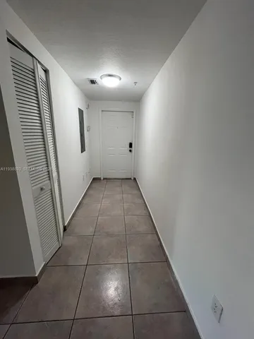 a view of hallway with a window