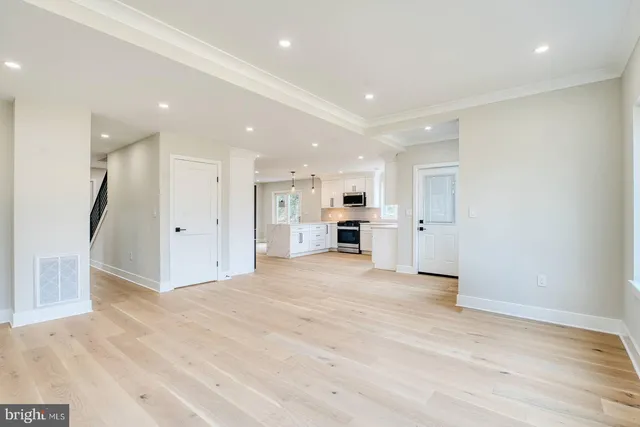 a view of kitchen with refrigerator and window