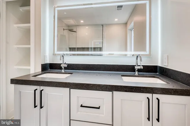 a kitchen with a sink and a window