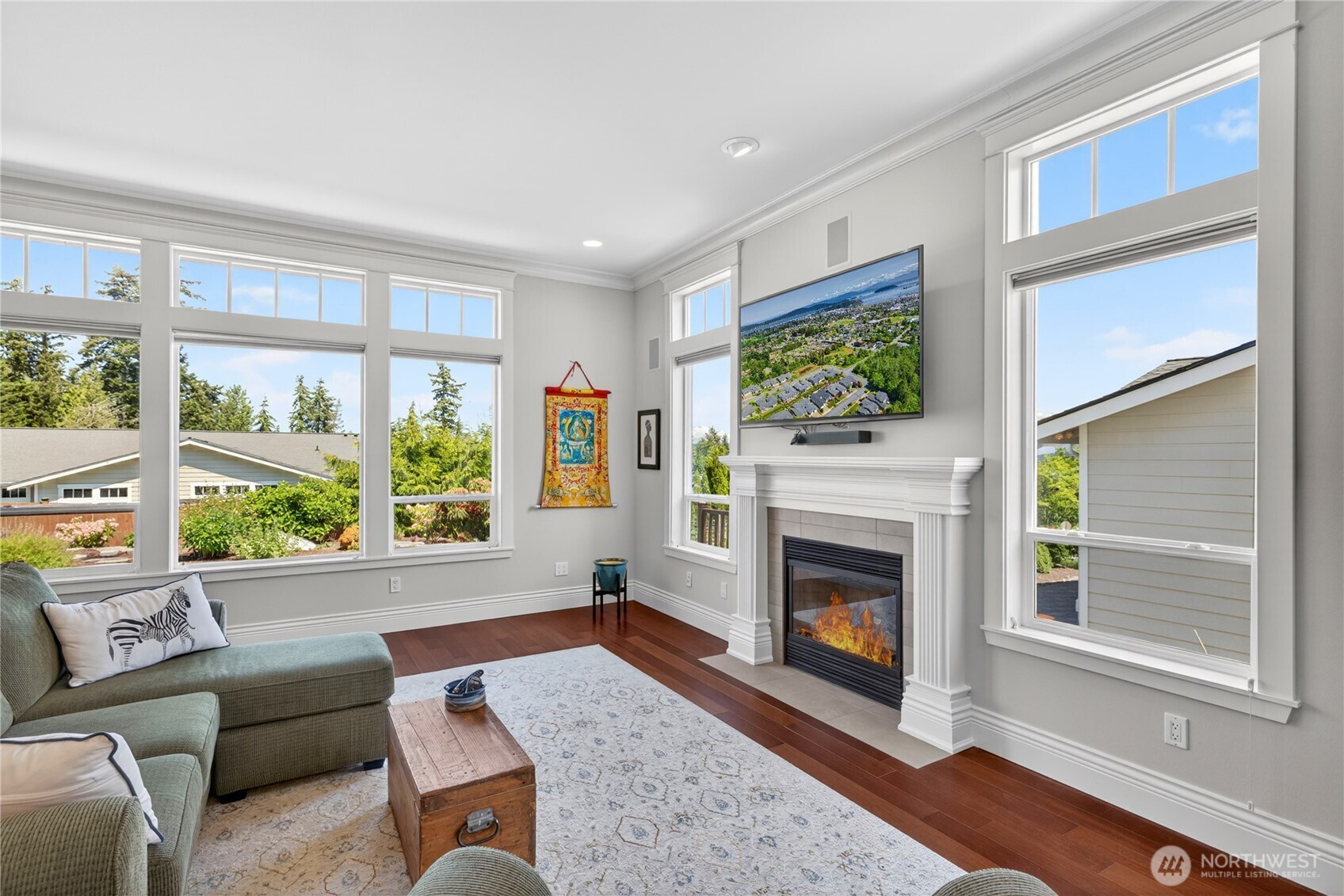 1908 29th Place Anacortes, WA 98221 - Photo 15 of 40 a living room with furniture a fireplace and a large window