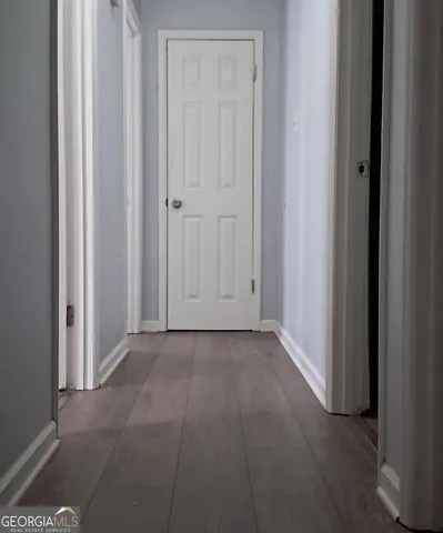 a white toilet sitting next to a bath tub