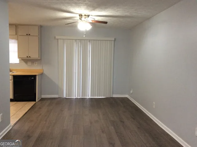 a kitchen with a refrigerator and a sink