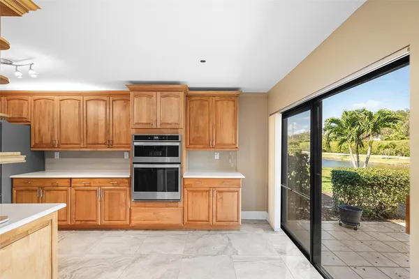 a kitchen with stainless steel appliances a stove sink and cabinets