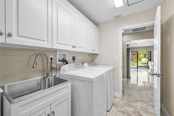 a kitchen with a sink and cabinets