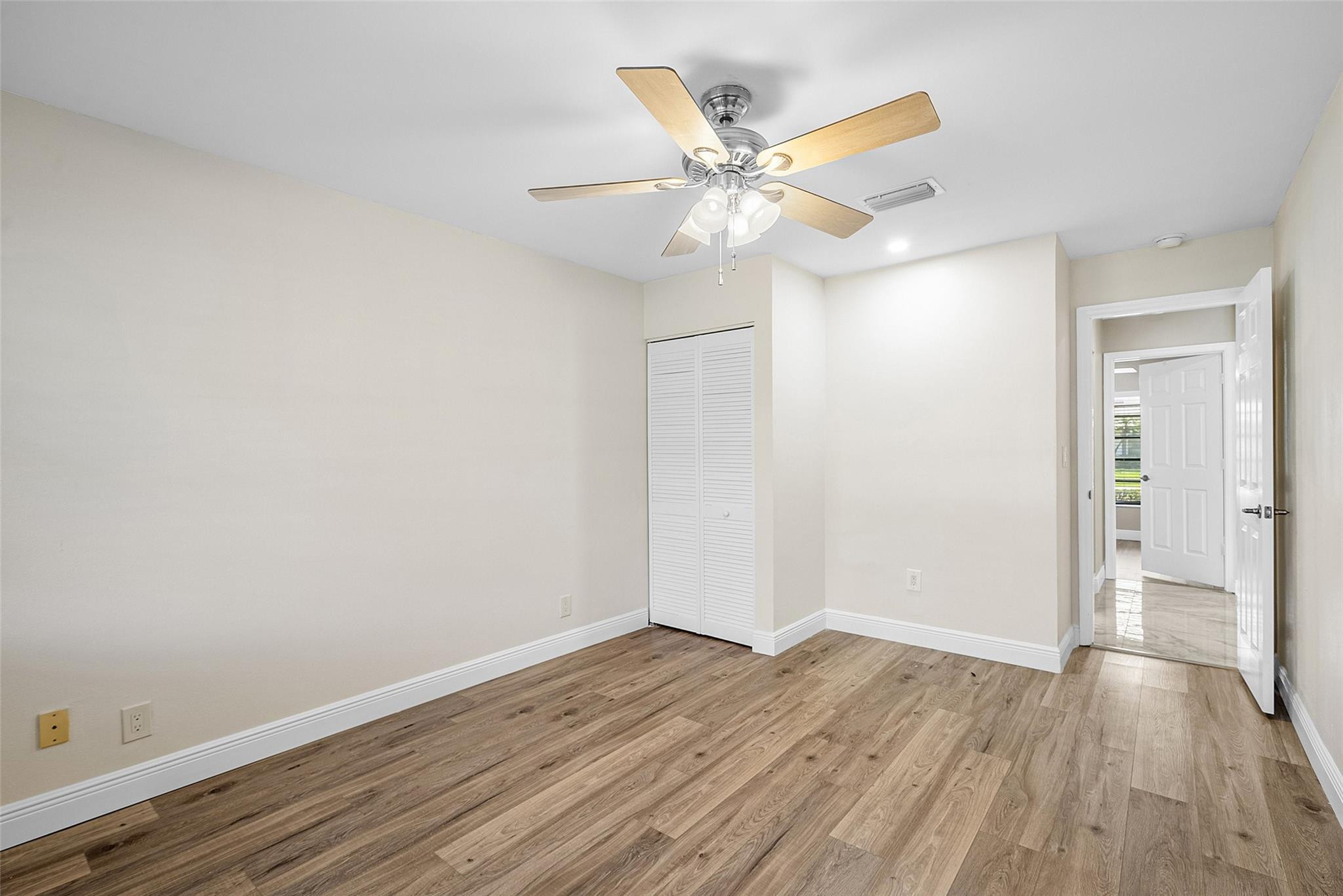 6191 Petaluma Drive Boca Raton, FL 33433 - Photo 22 of 36 wooden floor in an empty room