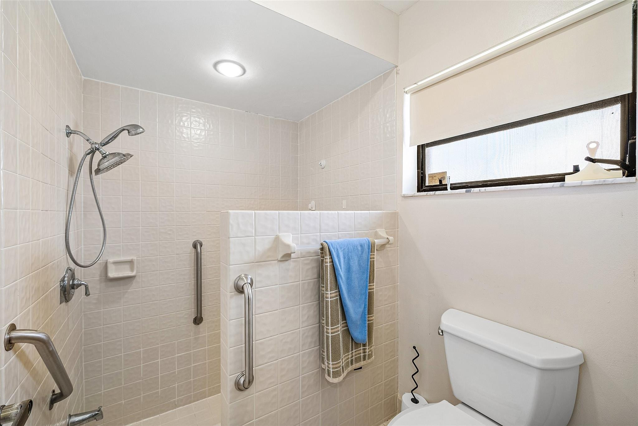 6191 Petaluma Drive Boca Raton, FL 33433 - Photo 24 of 36 a bathroom with a toilet and a shower