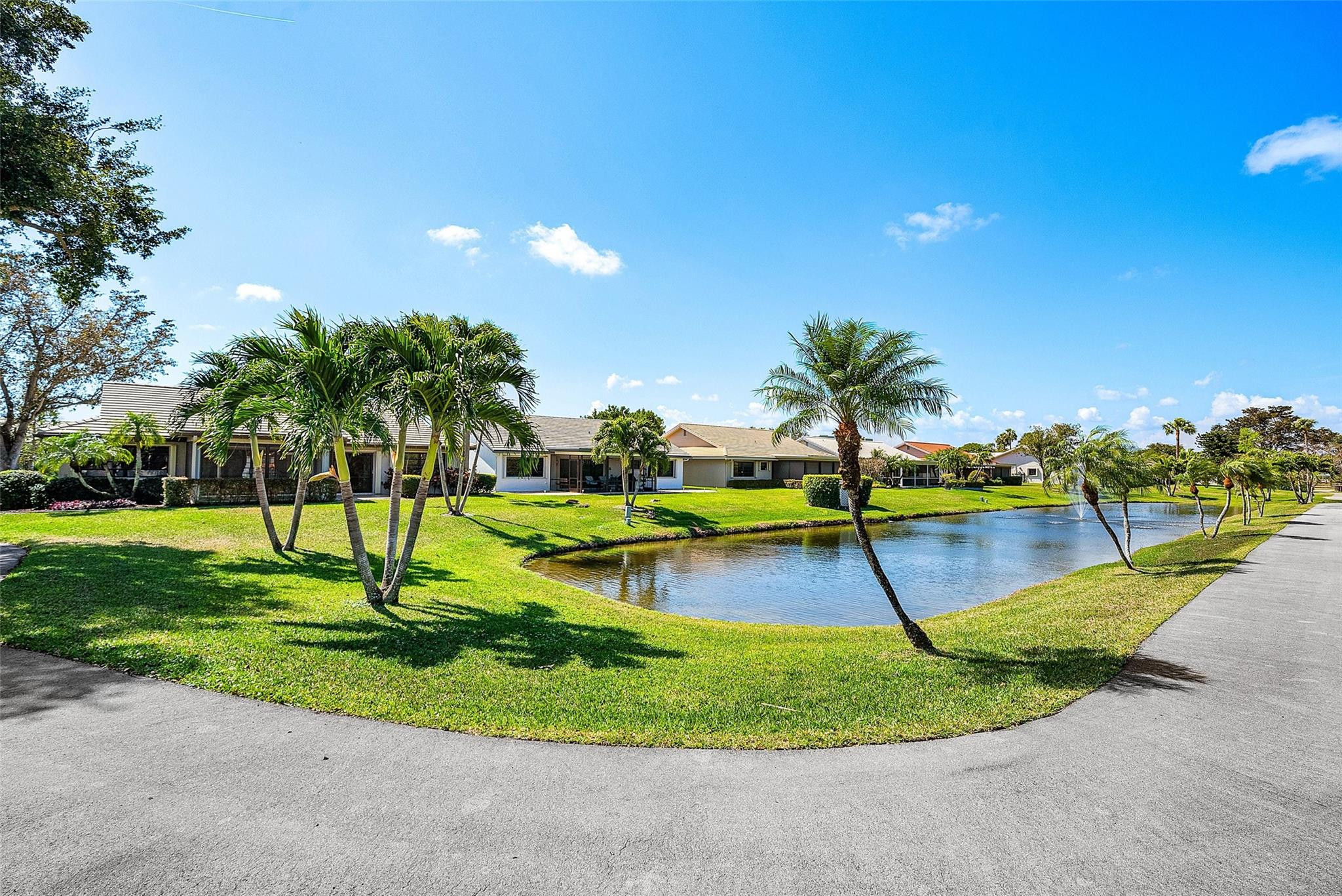 6191 Petaluma Drive Boca Raton, FL 33433 - Photo 34 of 36 a view of a park with swings and slides