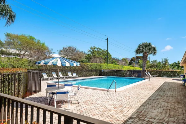 a view of a swimming pool with a patio