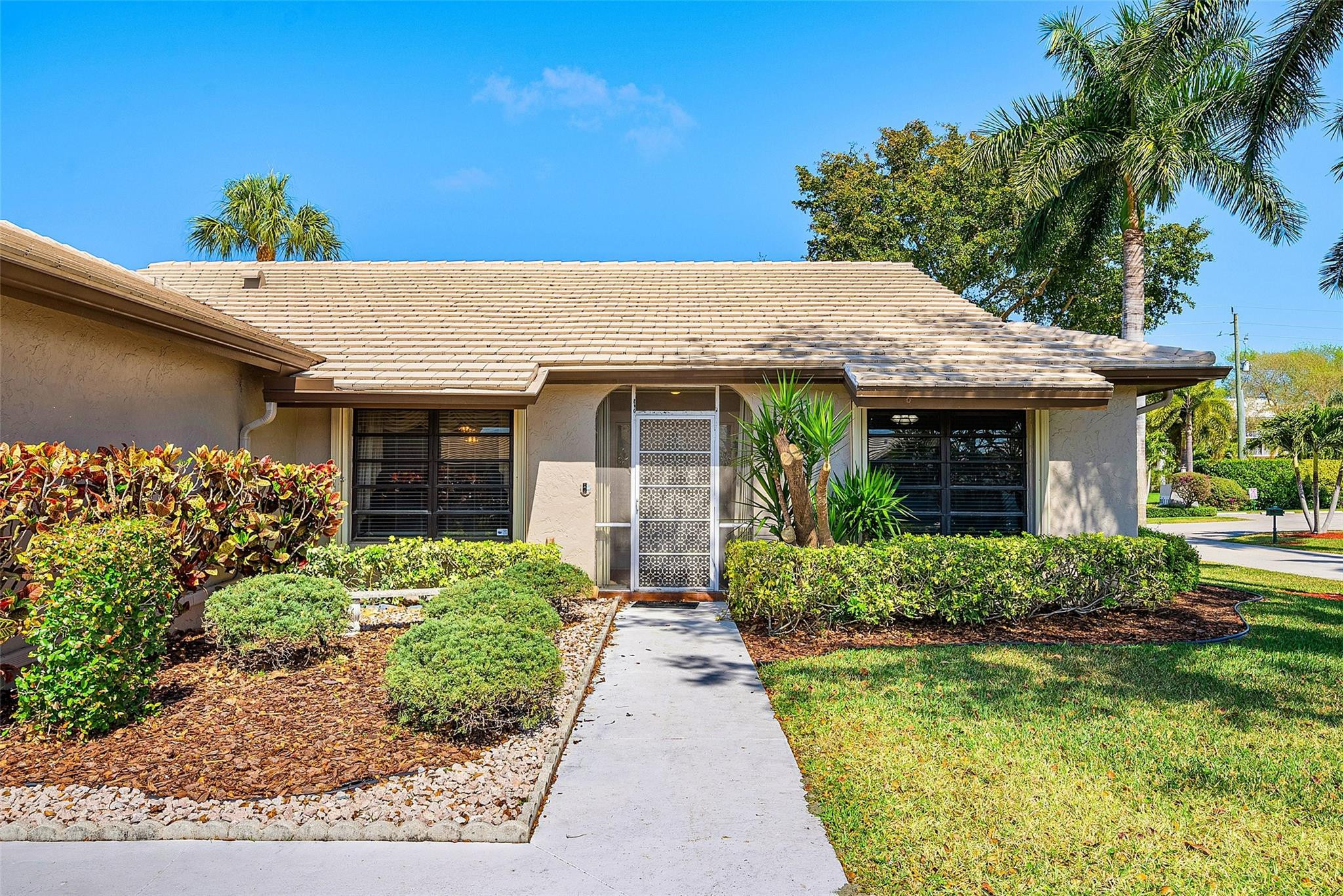 6191 Petaluma Drive Boca Raton, FL 33433 - Photo 4 of 36 front view of a house with a yard