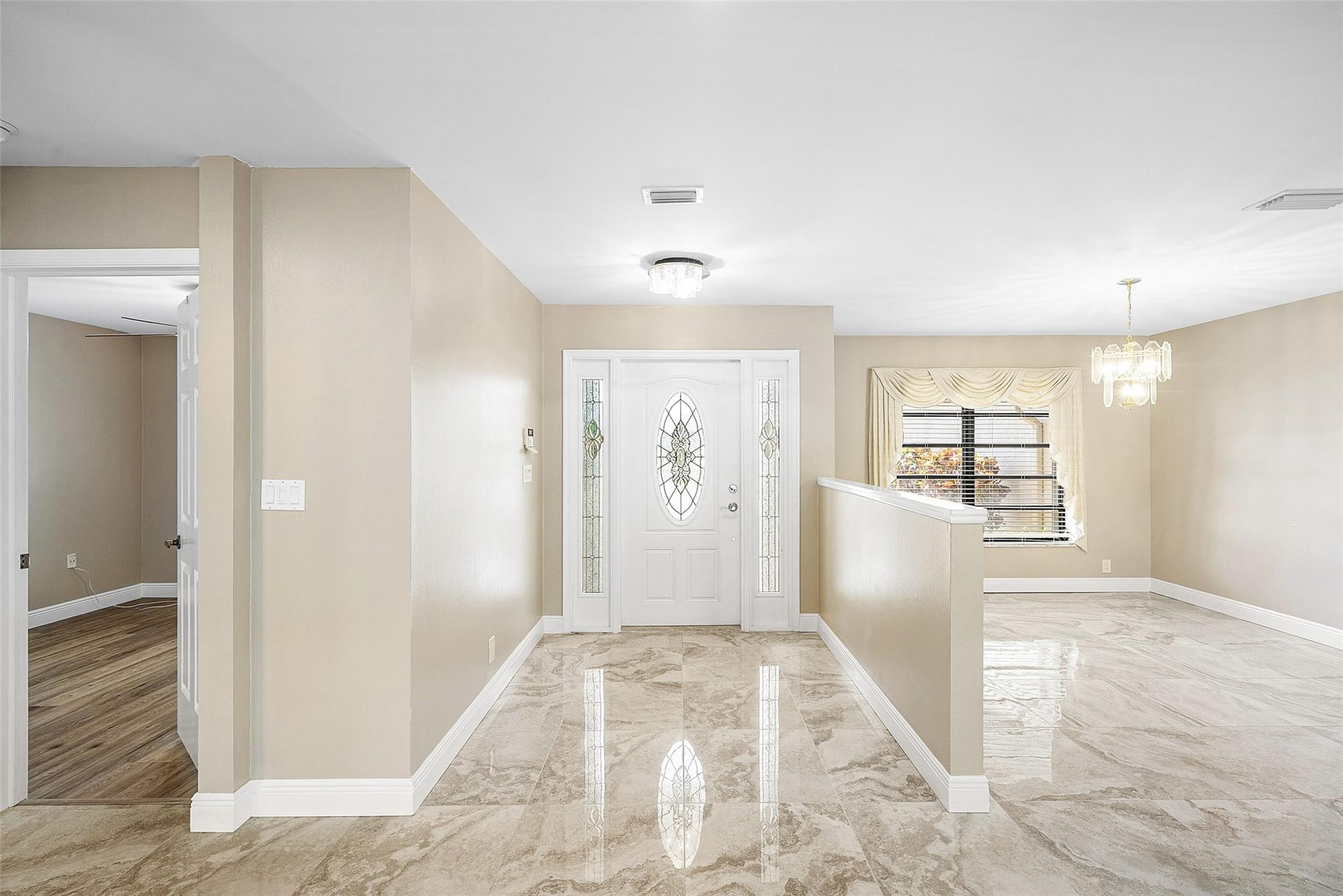 6191 Petaluma Drive Boca Raton, FL 33433 - Photo 6 of 36 a view of livingroom with window and hardwood floor
