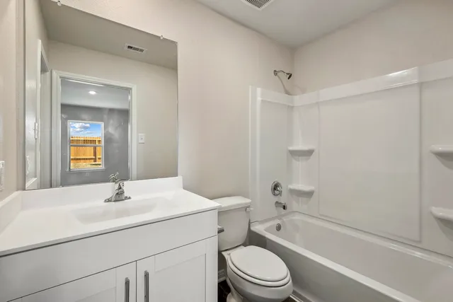 a bathroom with a sink toilet and bathtub