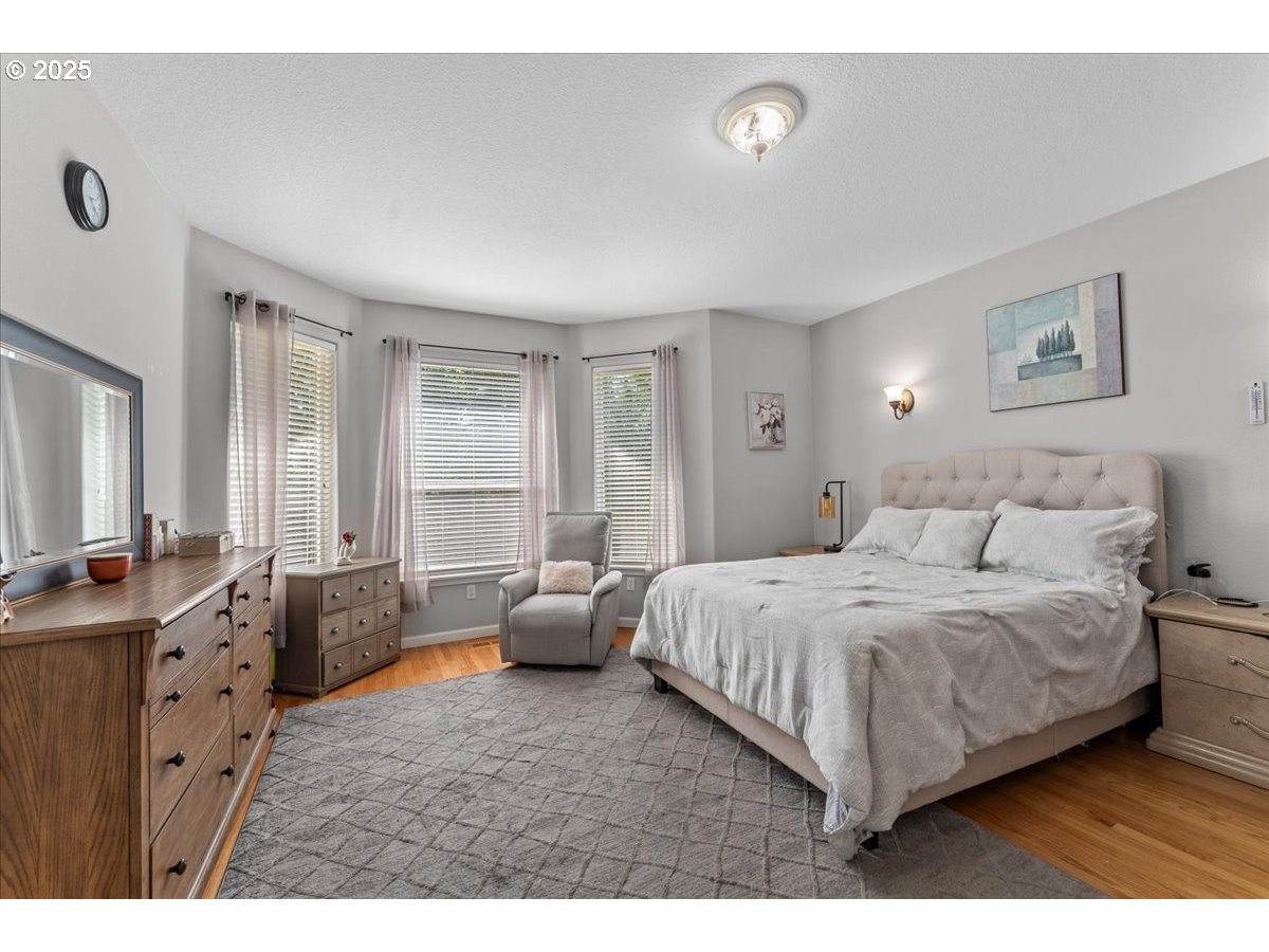 5122 Southeast Jenne Road Portland, OR 97236 - Photo 19 of 36 a bedroom with a bed and a couch