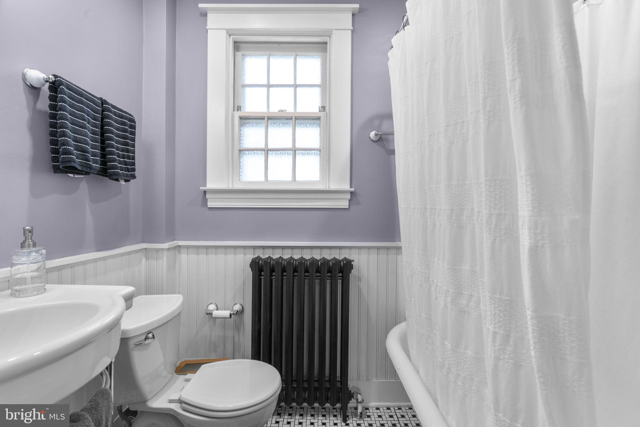 664 Regester Avenue Baltimore, MD 21212 - Photo 19 of 42 a white toilet sitting next to a bathroom sink