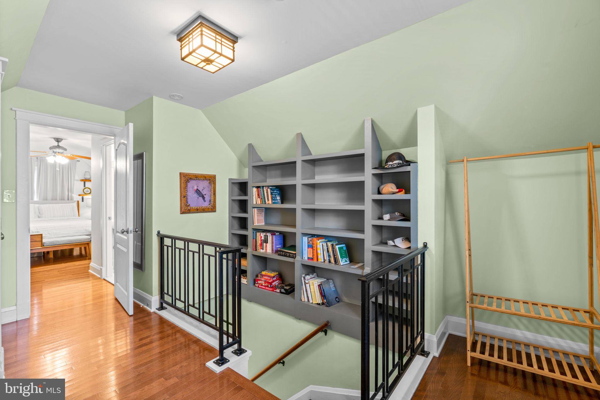 664 Regester Avenue Baltimore, MD 21212 - Photo 20 of 42 a view of a hallway with wooden floor and furniture