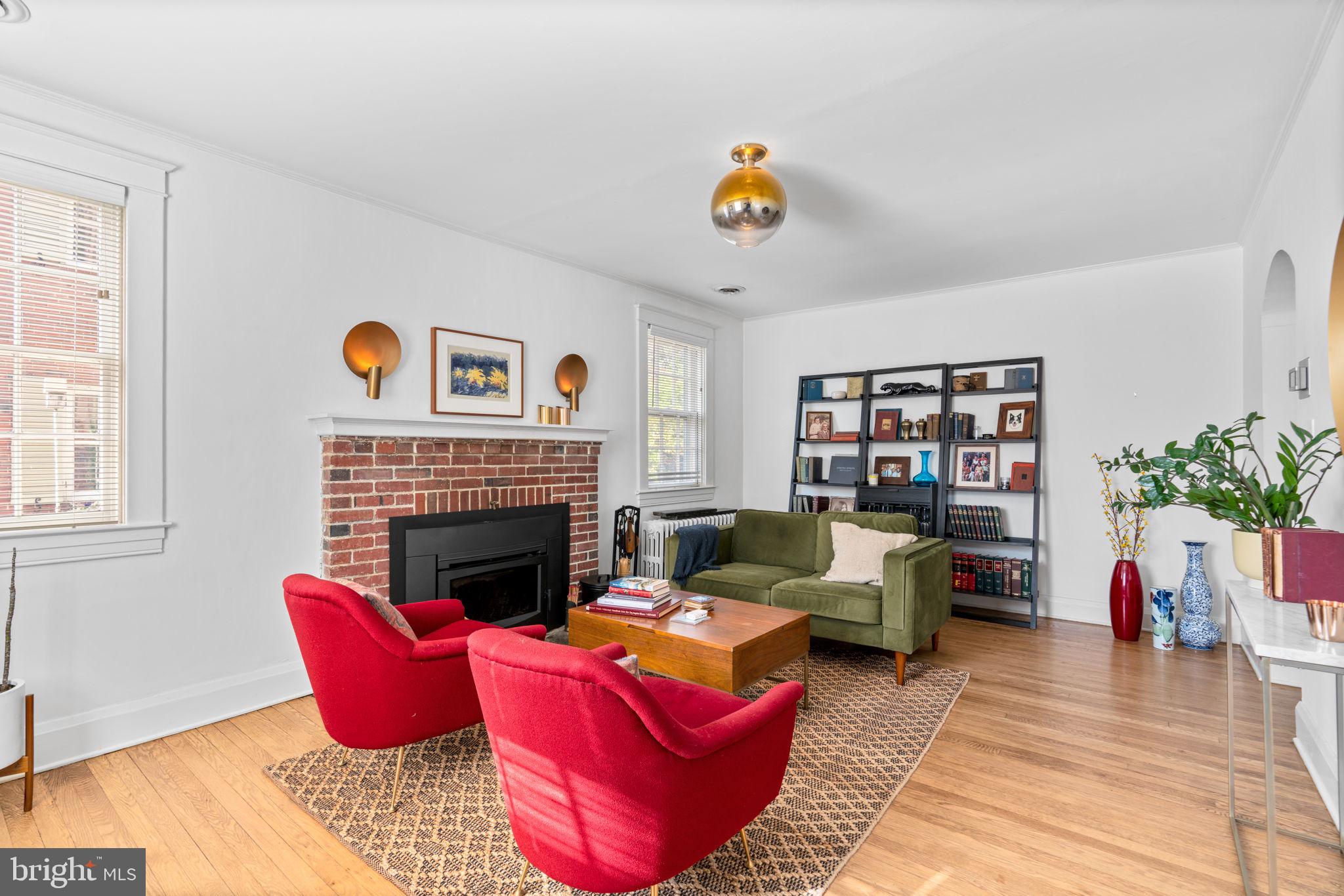 664 Regester Avenue Baltimore, MD 21212 - Photo 5 of 42 a living room with furniture and a fireplace