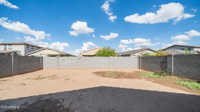 a view of a backyard of the house