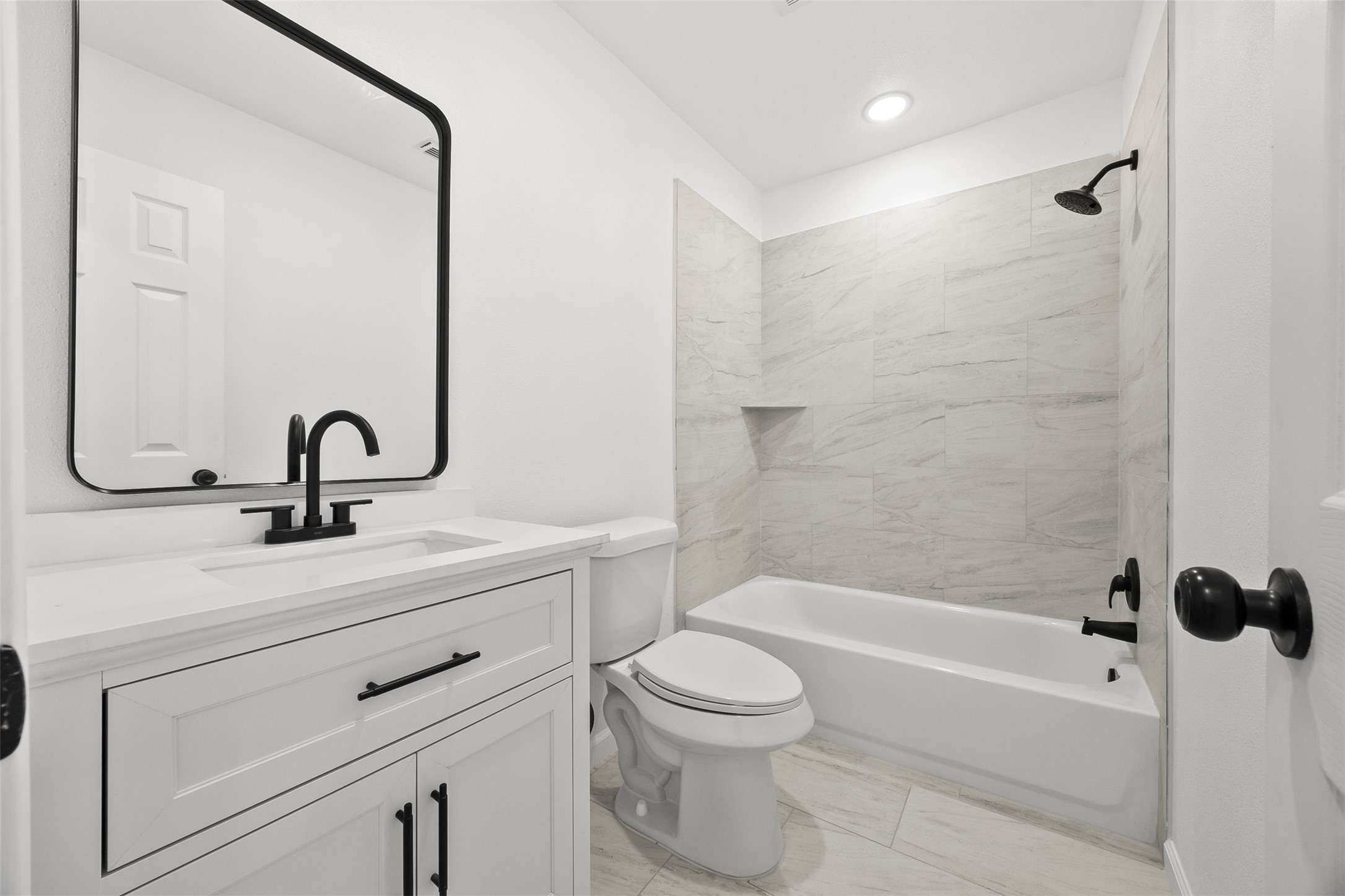 22101 Diane Drive Spring, TX 77373 - Photo 14 of 24 a bathroom with a sink a toilet and a bathtub