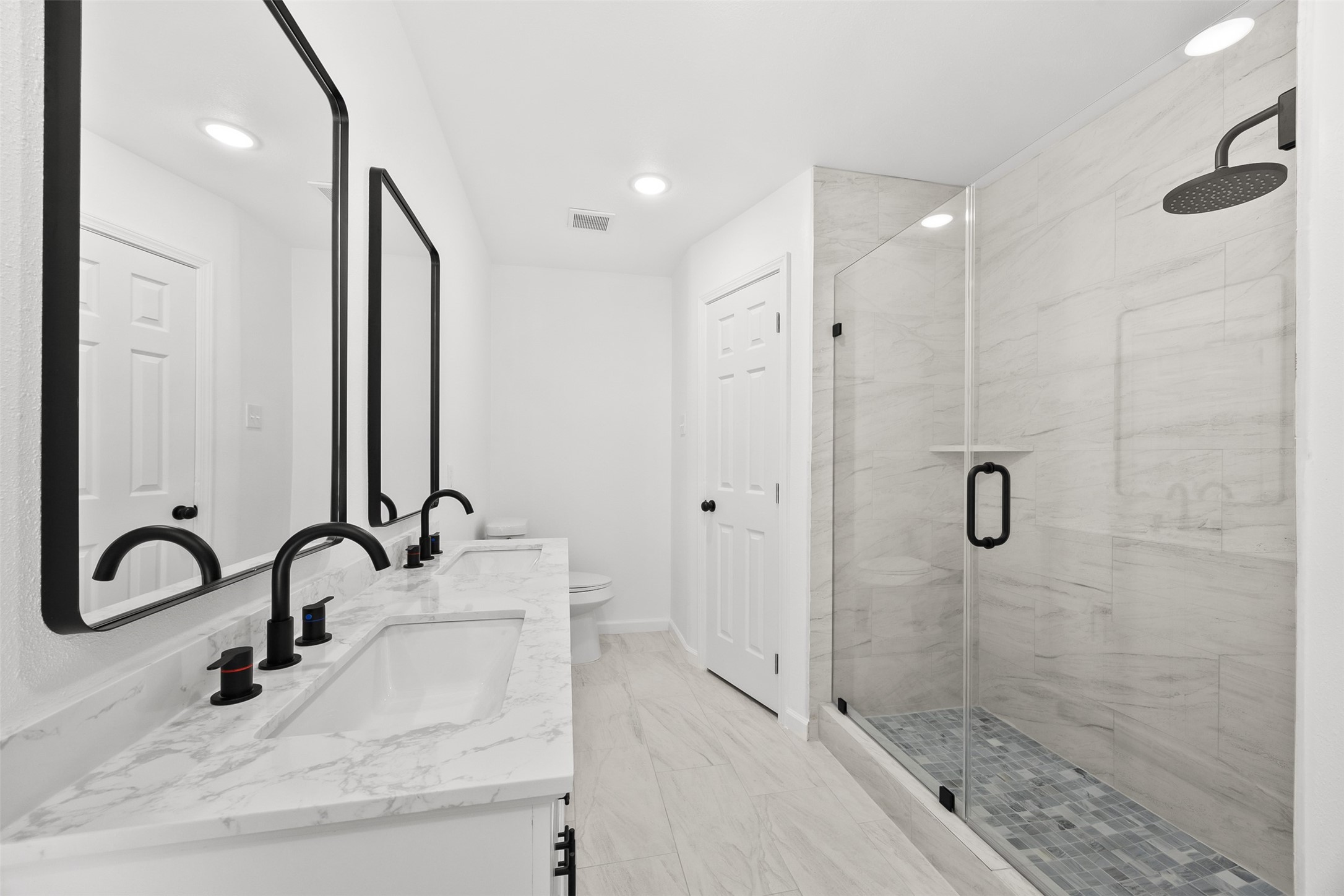 22101 Diane Drive Spring, TX 77373 - Photo 17 of 24 a bathroom with a shower sink and mirror