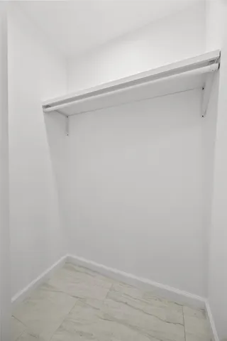 a view of an empty walk in closet