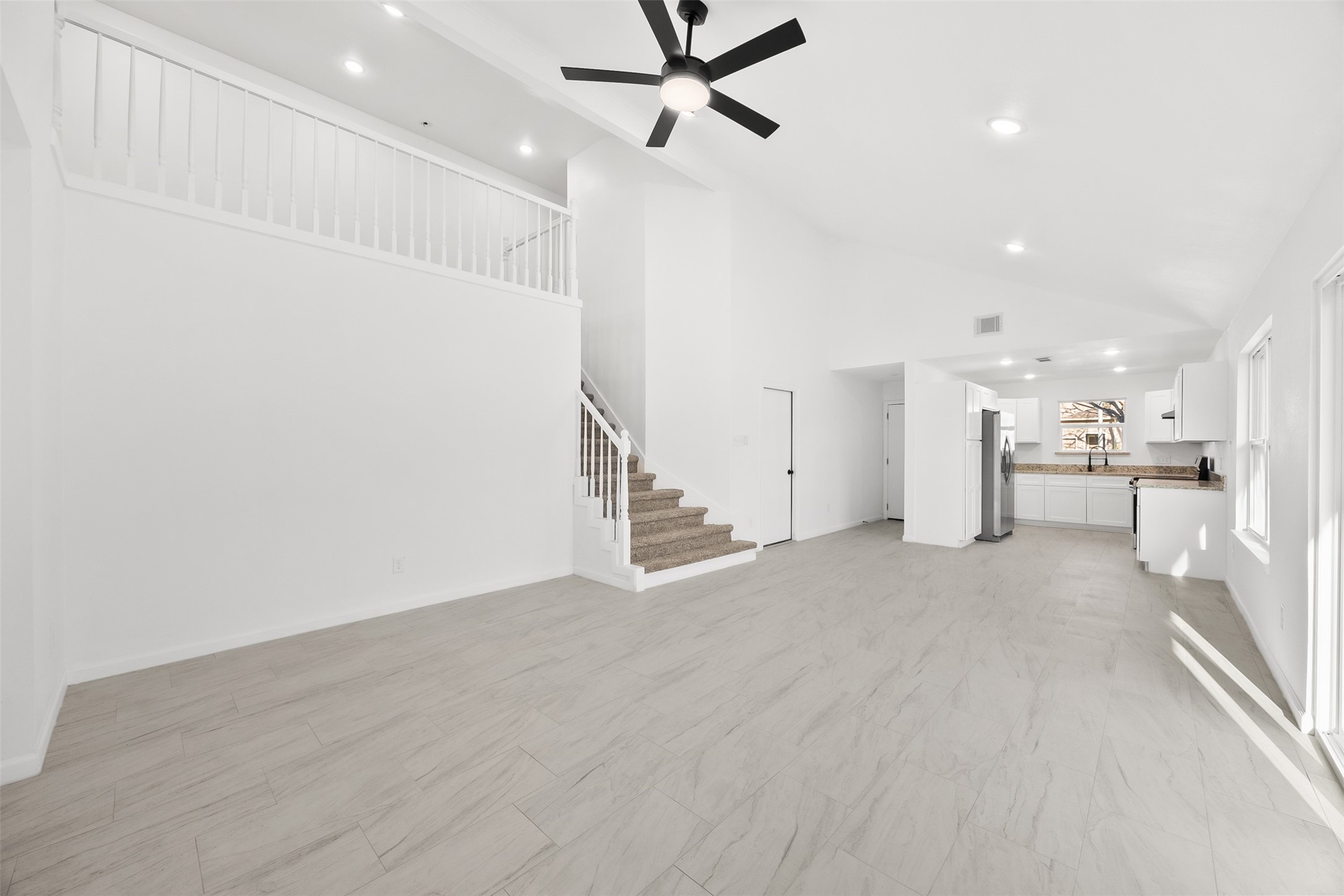 22101 Diane Drive Spring, TX 77373 - Photo 8 of 24 a view of a kitchen with a sink and a refrigerator