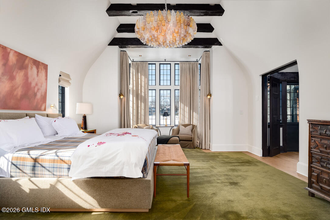 44 Khakum Wood Road Greenwich, CT 06831 - Photo 15 of 31 a bedroom with a bed and wooden floor