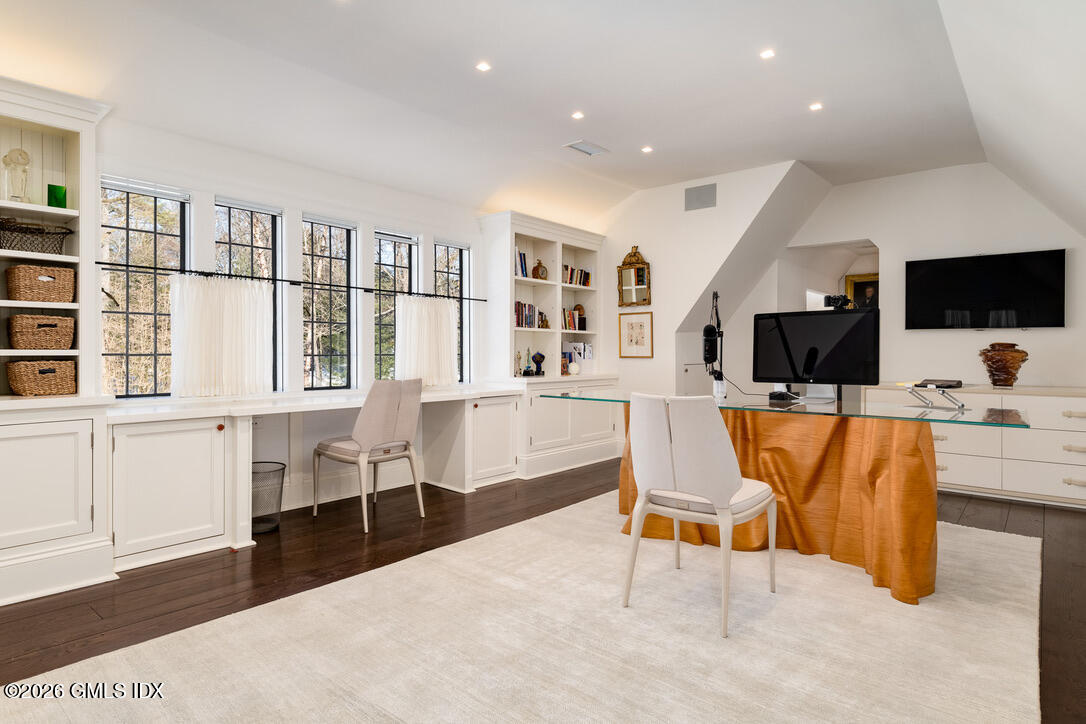 44 Khakum Wood Road Greenwich, CT 06831 - Photo 27 of 31 a living room with furniture and a flat screen tv