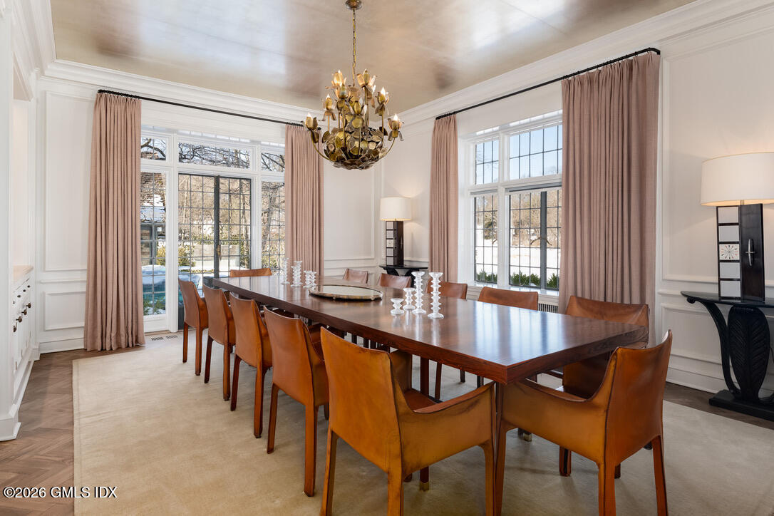 44 Khakum Wood Road Greenwich, CT 06831 - Photo 4 of 7 a dining room with furniture a chandelier and window