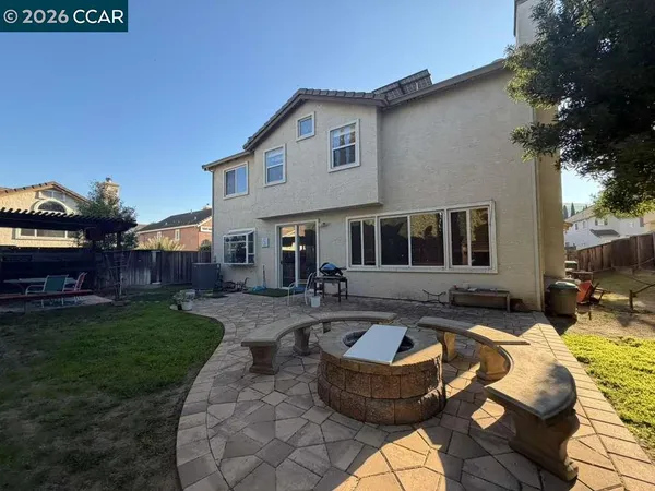 a front view of house with yard seating and green space