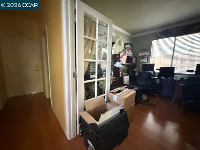 a kitchen with a refrigerator and a sink