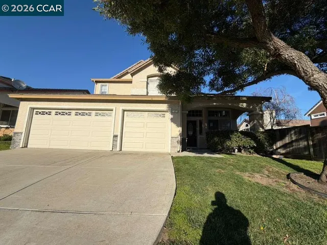 a view of a hallway with wooden floor and stairs