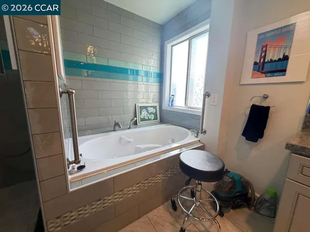 a bathroom with a granite countertop toilet sink and shower
