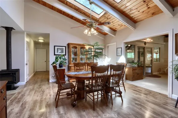 a kitchen with granite countertop lots of clutter and stainless steel appliances