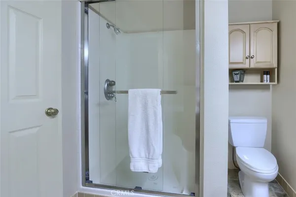 a bedroom with furniture and a chandelier