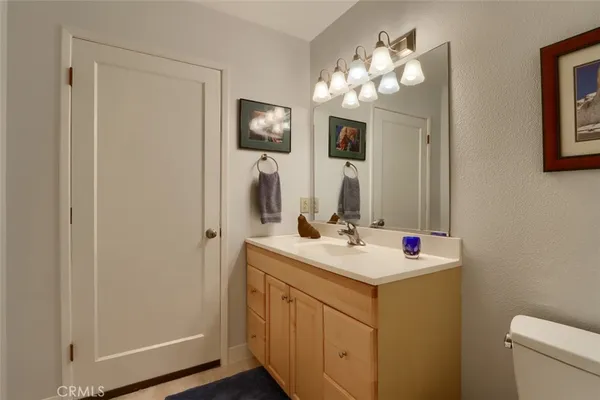 a kitchen with a stove and a white cabinets