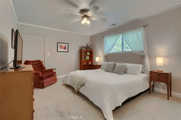 a room with stainless steel appliances kitchen island granite countertop a refrigerator a stove and a sink