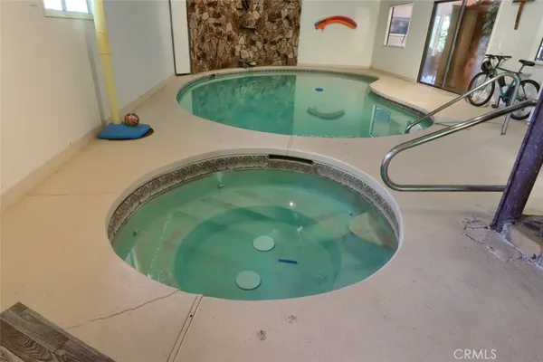 a view of backyard with seating space and trees