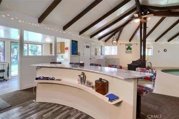 a view of a couches and tables in the balcony